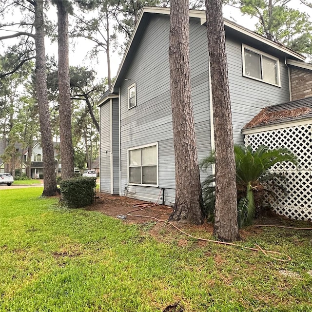 12006 Mill Trail Ln, Houston, TX 77070 - view of side of property with a lawn