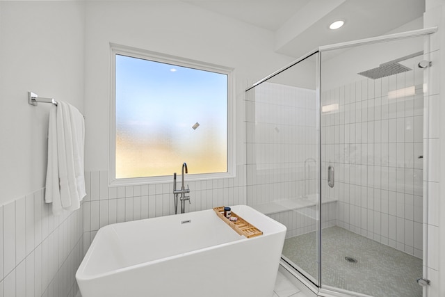 1546 W Tidwell Rd, Houston, TX 77091 - bathroom featuring a shower stall, tile walls, a soaking tub, recessed lighting, and tile patterned floors