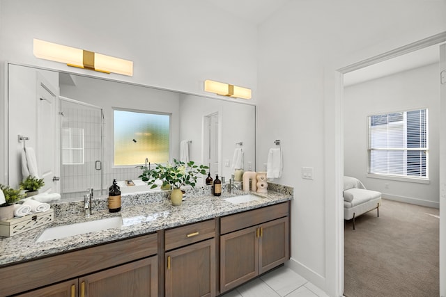 1546 W Tidwell Rd, Houston, TX 77091 - ensuite bathroom featuring double vanity, a stall shower, and healthy amount of natural light