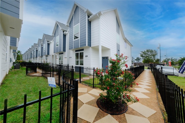 1546 W Tidwell Rd, Houston, TX 77091 - view of side of property with a central AC unit and a residential view