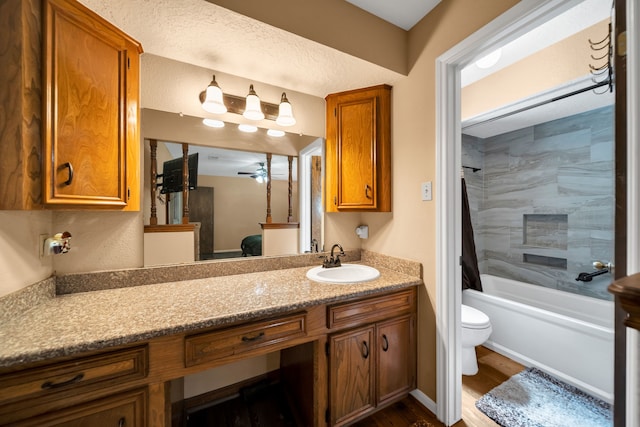 13202 N Decker Dr, Magnolia, TX 77355 - bathroom with ceiling fan, vanity, wood finished floors, and washtub / shower combination
