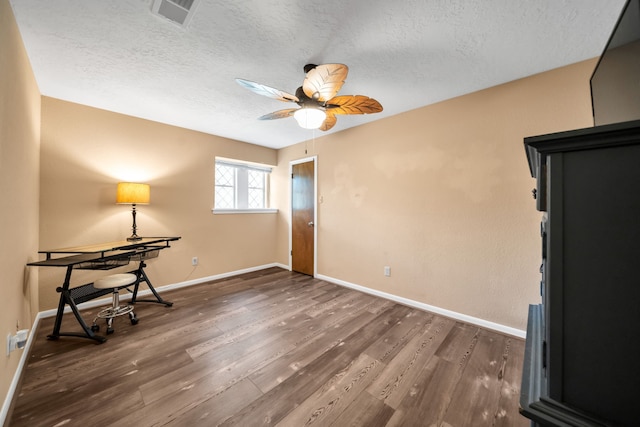 13202 N Decker Dr, Magnolia, TX 77355 - spare room with a ceiling fan, wood finished floors, and a textured ceiling