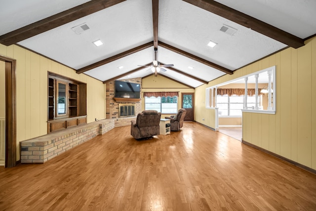 13202 N Decker Dr, Magnolia, TX 77355 - living room with wood finished floors, ceiling fan, and a fireplace