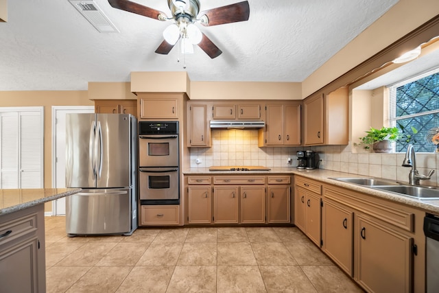 13202 N Decker Dr, Magnolia, TX 77355 - kitchen featuring appliances with stainless steel finishes, ceiling fan, tasteful backsplash, light countertops, and light tile patterned floors