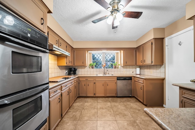 13202 N Decker Dr, Magnolia, TX 77355 - kitchen with stainless steel appliances, light countertops, a textured ceiling, decorative backsplash, and under cabinet range hood