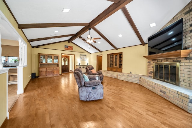 13202 N Decker Dr, Magnolia, TX 77355 - living area with a brick fireplace, ceiling fan, and wood finished floors