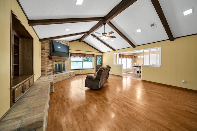 13202 N Decker Dr, Magnolia, TX 77355 - unfurnished living room with ceiling fan, wood finished floors, and a fireplace