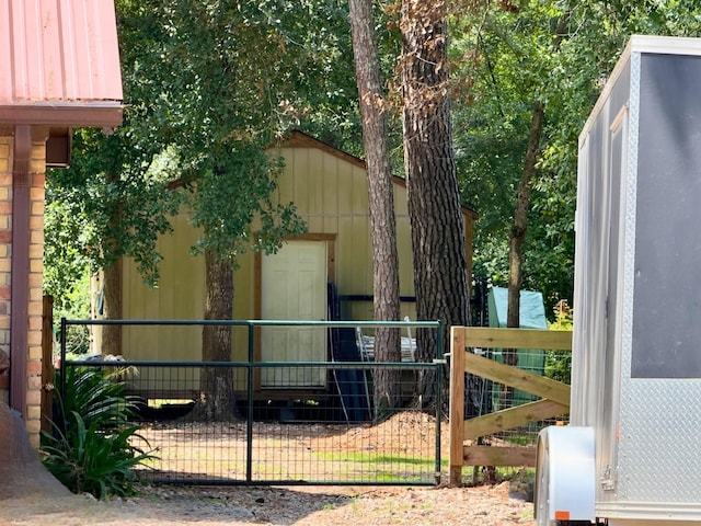 13202 N Decker Dr, Magnolia, TX 77355 - view of side of home with a gate and a storage shed