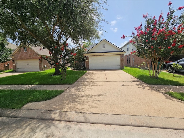 15506 Fir Woods Ln, Cypress, TX 77429 - view of front facade featuring brick siding, a garage, a front lawn, and concrete driveway