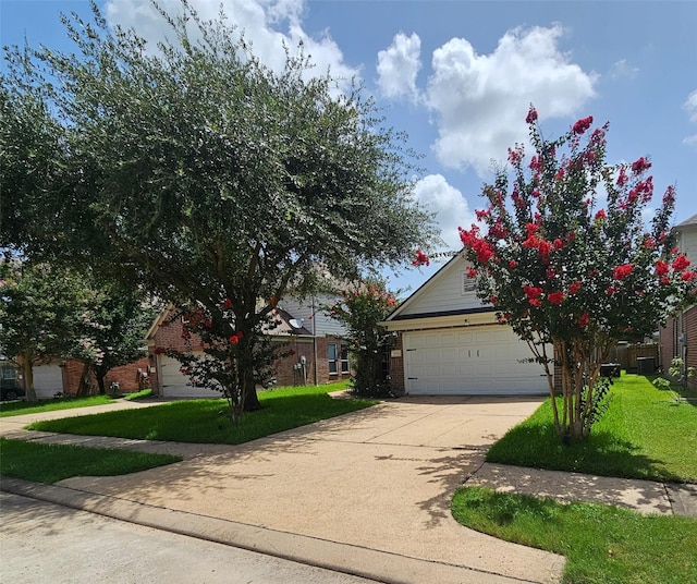 15506 Fir Woods Ln, Cypress, TX 77429 - view of property hidden behind natural elements with brick siding, a front lawn, and driveway