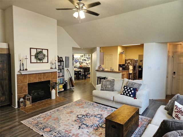 15506 Fir Woods Ln, Cypress, TX 77429 - living room featuring a ceiling fan, wood finished floors, a fireplace, and vaulted ceiling