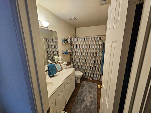 15506 Fir Woods Ln, Cypress, TX 77429 - bathroom featuring vanity, tile patterned floors, a textured ceiling, and a shower with shower curtain