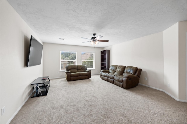 16606 River Wood Ct, Crosby, TX 77532 - carpeted living area featuring ceiling fan and a textured ceiling