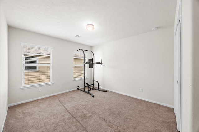 16606 River Wood Ct, Crosby, TX 77532 - workout room featuring carpet flooring and baseboards
