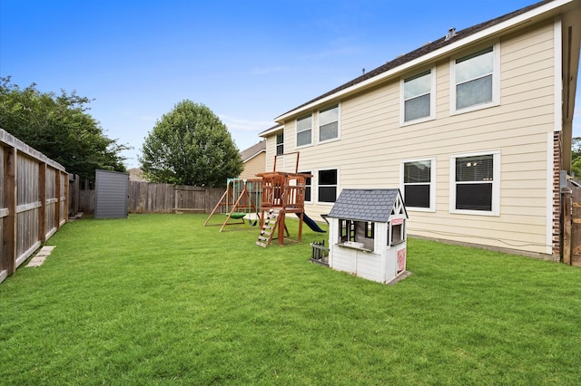 16606 River Wood Ct, Crosby, TX 77532 - back of property featuring a playground and a fenced backyard