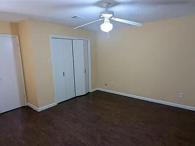 7822 Albin Ln, Houston, TX 77071 - unfurnished bedroom featuring a closet, a ceiling fan, and wood finished floors