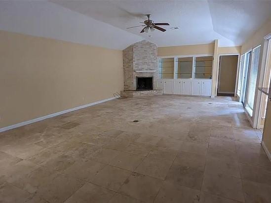 7822 Albin Ln, Houston, TX 77071 - unfurnished living room featuring lofted ceiling, ceiling fan, and a brick fireplace