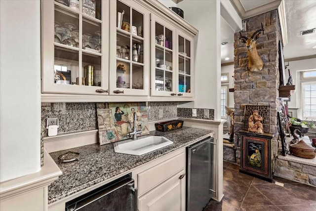 3039 Bayshore Dr, Bacliff, TX 77518 - indoor wet bar featuring crown molding, tasteful backsplash, dishwasher, and a fireplace