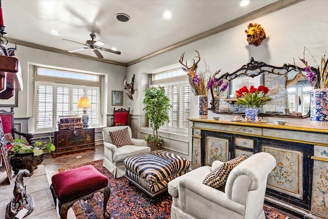 3039 Bayshore Dr, Bacliff, TX 77518 - living area with crown molding, a ceiling fan, a decorative wall, a wainscoted wall, and recessed lighting
