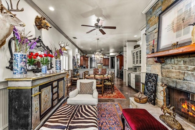 3039 Bayshore Dr, Bacliff, TX 77518 - living area with a stone fireplace, ornamental molding, ceiling fan, a chandelier, and recessed lighting