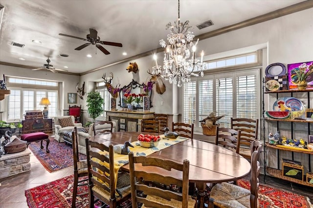 3039 Bayshore Dr, Bacliff, TX 77518 - tiled dining space featuring crown molding, a ceiling fan, recessed lighting, and a chandelier