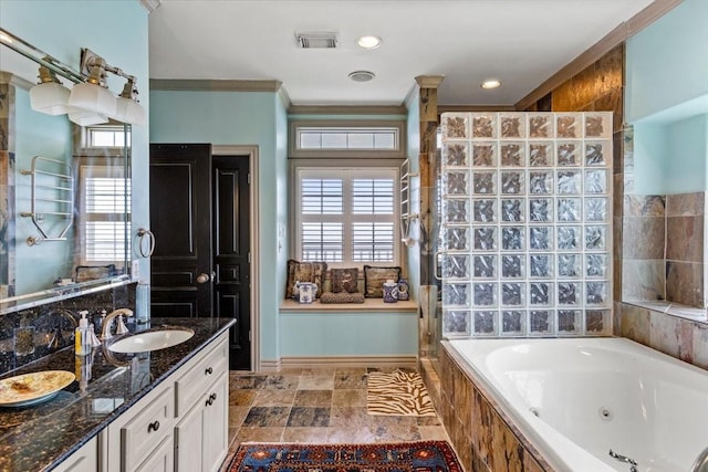 3039 Bayshore Dr, Bacliff, TX 77518 - bathroom with a jetted tub, vanity, ornamental molding, healthy amount of natural light, and a tile shower