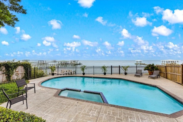 3039 Bayshore Dr, Bacliff, TX 77518 - view of pool with a water view, a patio area, and a pool with connected hot tub