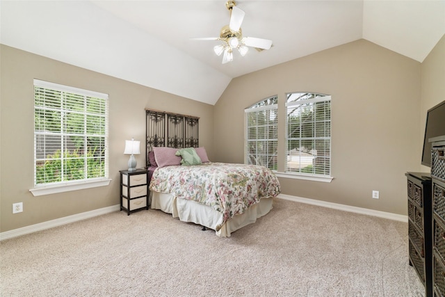 1915 Stormcroft Cir, Katy, TX 77450 - carpeted bedroom featuring multiple windows, lofted ceiling, and a ceiling fan