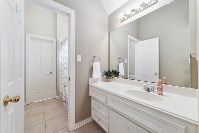 1915 Stormcroft Cir, Katy, TX 77450 - full bathroom with vanity, tile patterned flooring, vaulted ceiling, and curtained shower