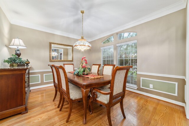 1915 Stormcroft Cir, Katy, TX 77450 - dining area with a chandelier, light wood-type flooring, and crown molding