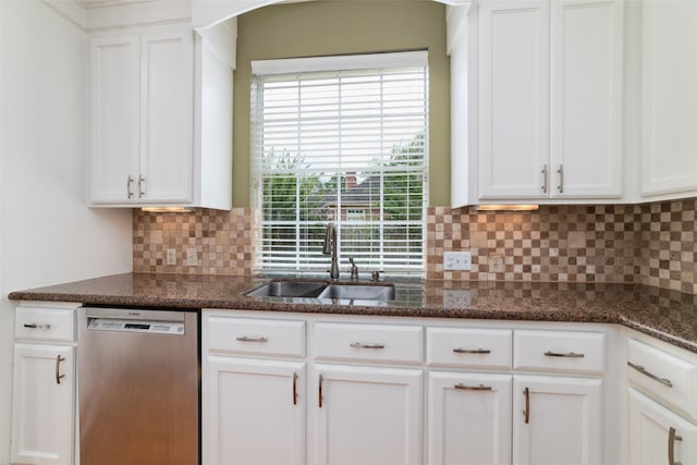 1915 Stormcroft Cir, Katy, TX 77450 - kitchen with dishwasher, white cabinetry, backsplash, and dark stone counters