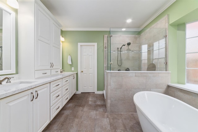 1915 Stormcroft Cir, Katy, TX 77450 - full bath featuring a shower stall, double vanity, a freestanding tub, crown molding, and recessed lighting