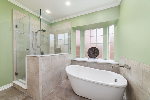 1915 Stormcroft Cir, Katy, TX 77450 - bathroom with a shower stall, a soaking tub, ornamental molding, tile walls, and recessed lighting