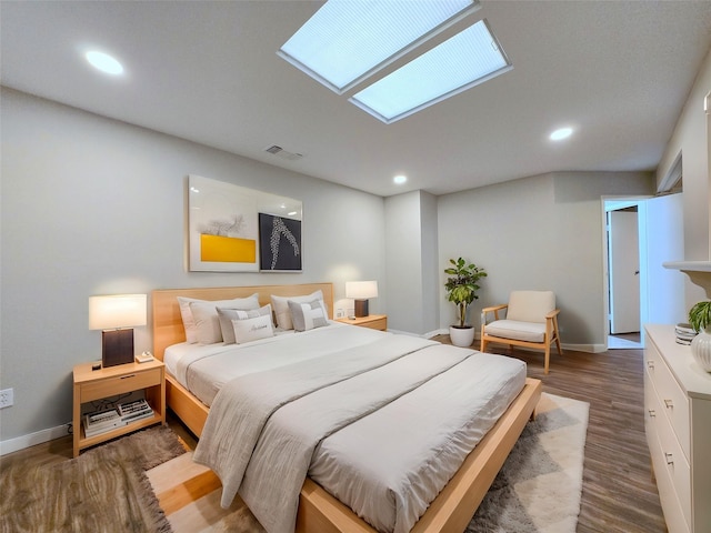 8100 Cambridge St Unit 99, Houston, TX 77054 - bedroom with wood finished floors and recessed lighting