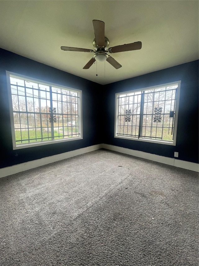2010 King St, Houston, TX 77026 - empty room featuring plenty of natural light, carpet floors, and ceiling fan