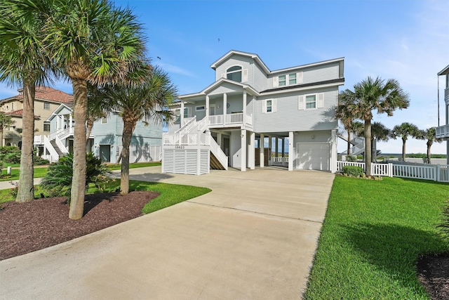 19623 Shores Dr, Galveston, TX 77554 - beach home featuring stairway, an attached garage, driveway, a porch, and a carport