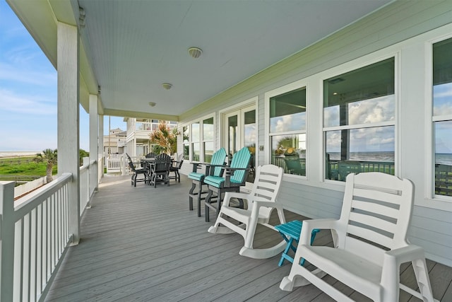 19623 Shores Dr, Galveston, TX 77554 - wooden deck with outdoor dining space