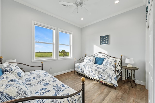 19623 Shores Dr, Galveston, TX 77554 - bedroom featuring ornamental molding, wood finished floors, ceiling fan, and recessed lighting