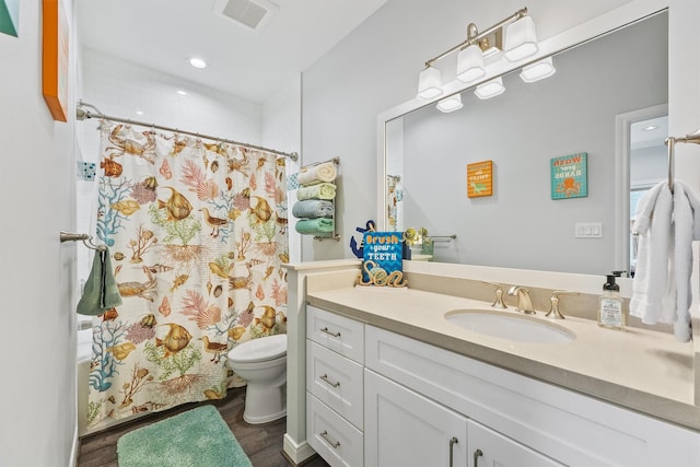 19623 Shores Dr, Galveston, TX 77554 - bathroom with vanity, wood finished floors, and recessed lighting