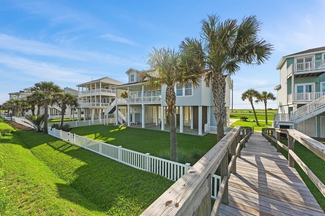 19623 Shores Dr, Galveston, TX 77554 - back of house with a fenced backyard and a patio area