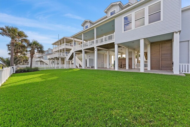 19623 Shores Dr, Galveston, TX 77554 - back of property with a patio, a fenced backyard, and stairs