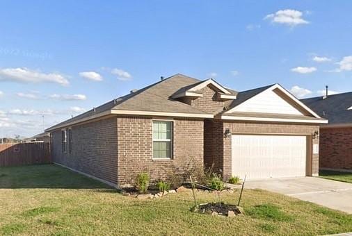6138 Lillybelle St, Katy, TX 77449 - ranch-style house with brick siding, a garage, and concrete driveway