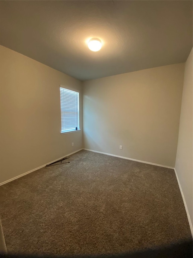 6138 Lillybelle St, Katy, TX 77449 - empty room featuring dark carpet and baseboards