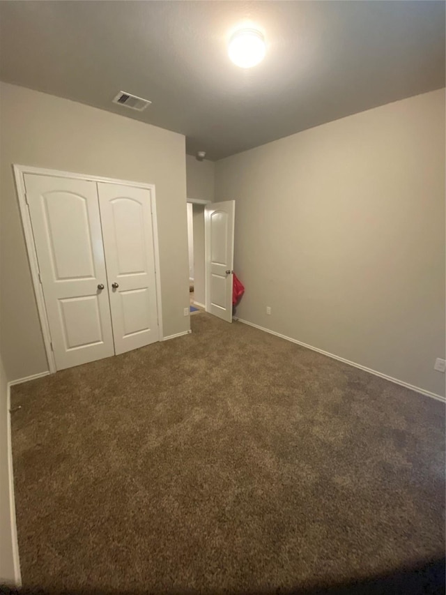 6138 Lillybelle St, Katy, TX 77449 - unfurnished bedroom with dark colored carpet and a closet