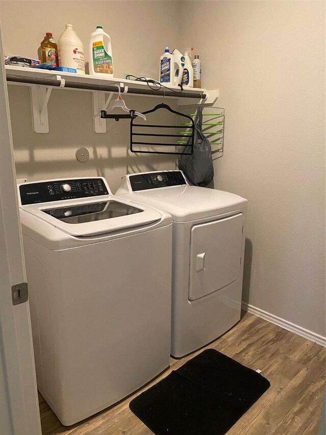 6138 Lillybelle St, Katy, TX 77449 - laundry area with washer and dryer and wood finished floors