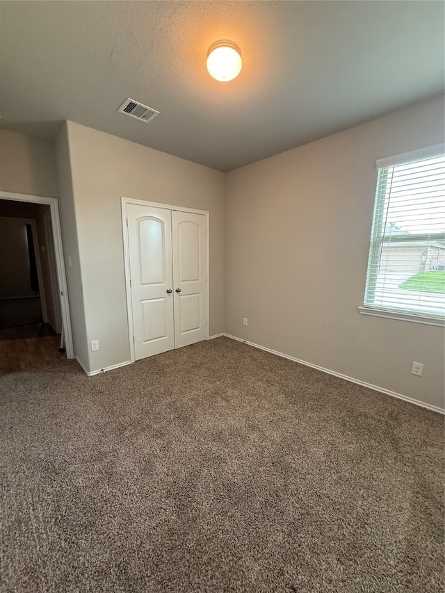 6138 Lillybelle St, Katy, TX 77449 - unfurnished bedroom featuring a closet and carpet