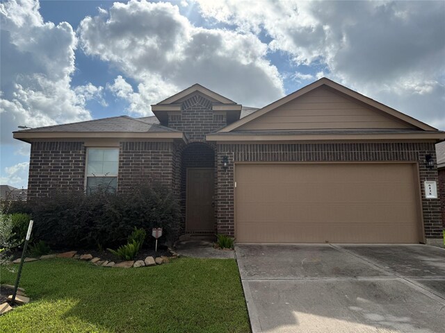 6138 Lillybelle St, Katy, TX 77449 - ranch-style house featuring brick siding, an attached garage, driveway, and a front yard