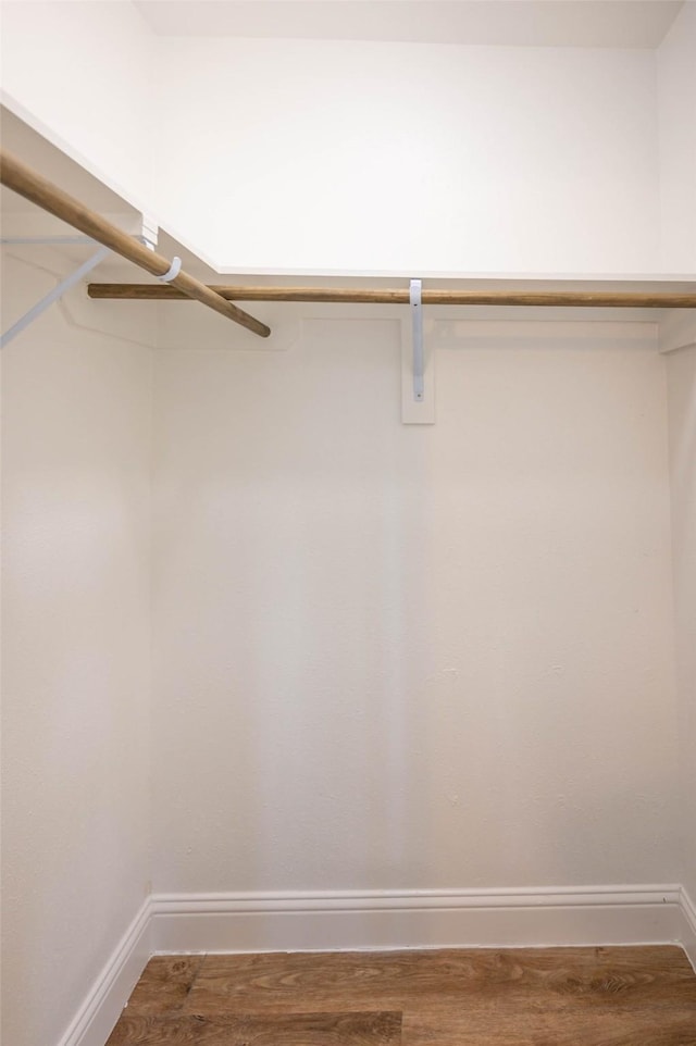 238 Almond Dr, Lake Jackson, TX 77566 - walk in closet with wood finished floors