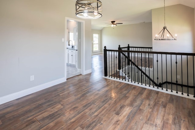 238 Almond Dr, Lake Jackson, TX 77566 - spare room featuring a chandelier, wood finished floors, ceiling fan, and lofted ceiling