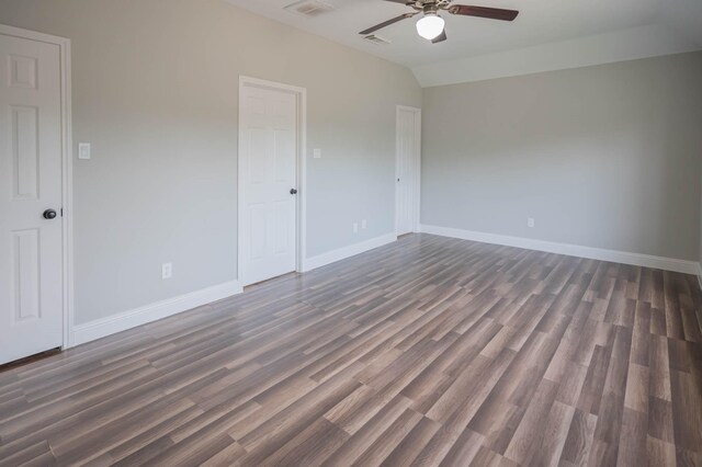238 Almond Dr, Lake Jackson, TX 77566 - unfurnished bedroom featuring dark wood-type flooring, a ceiling fan, and vaulted ceiling